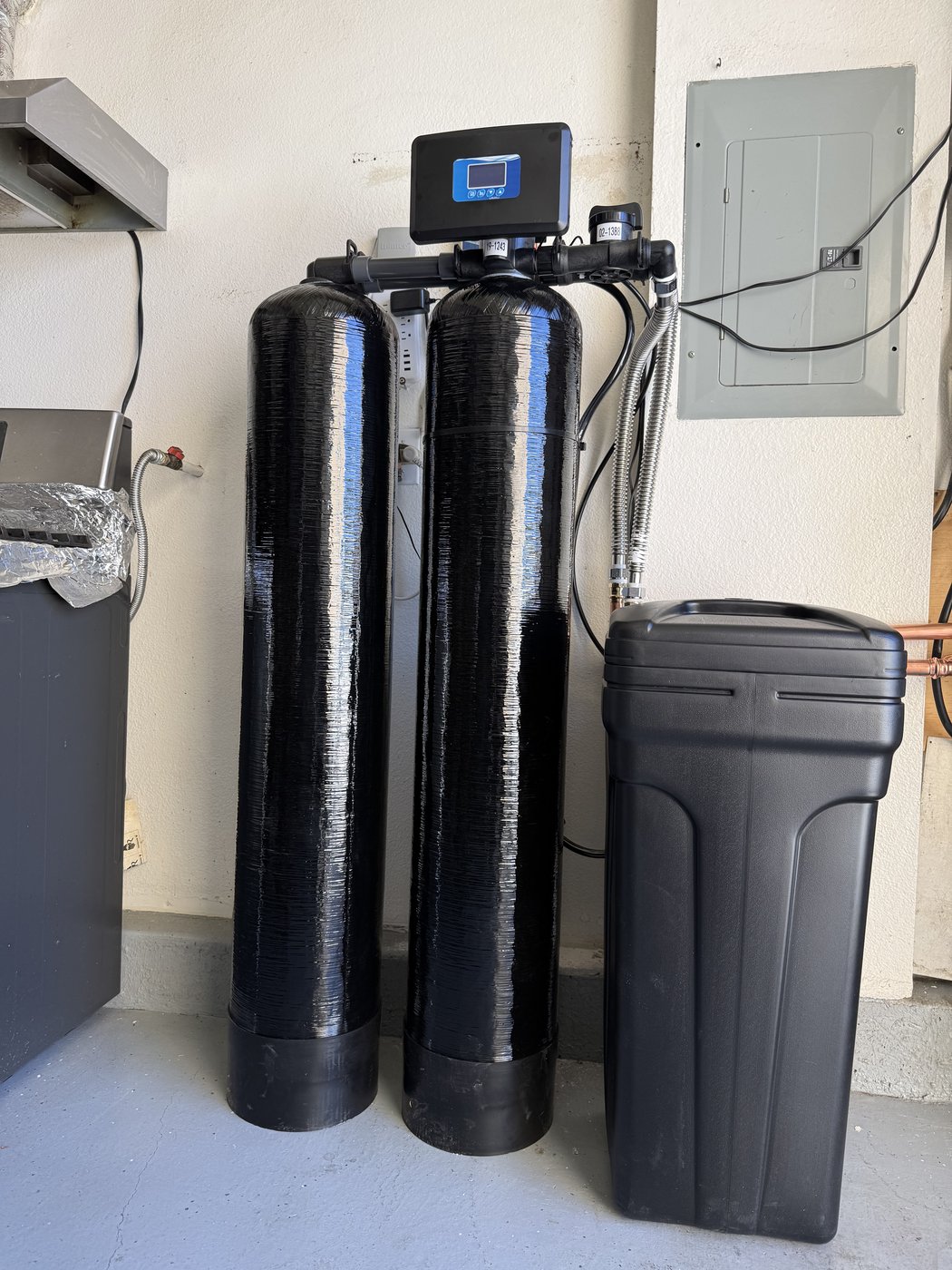 Honest Water Co outdoor dual-tank water softener installation with smart valve display in Southern California